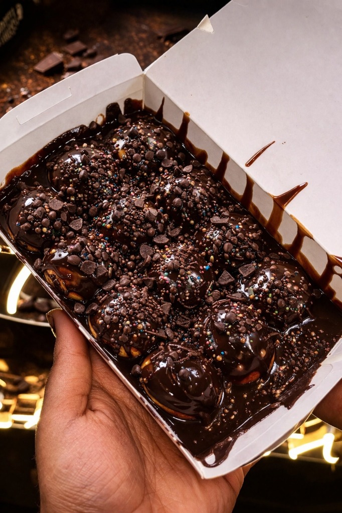 Crispy Belgian waffle topped with fresh whipped cream and chocolate drizzle - Taste & Craviing specialty